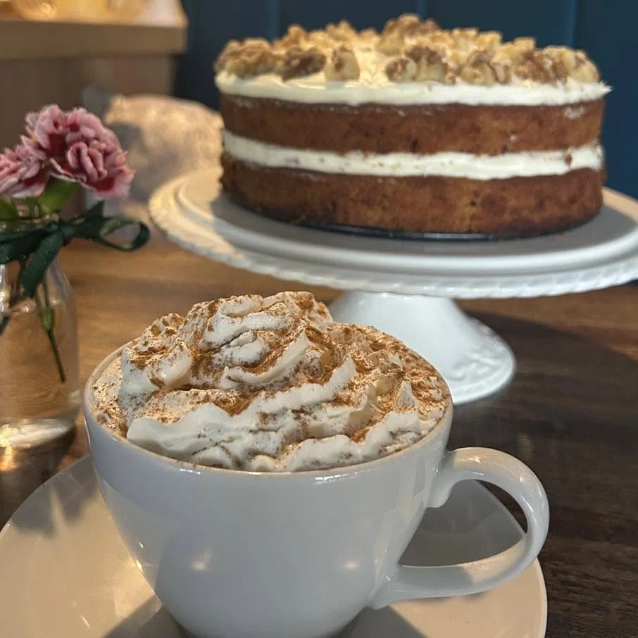 A cappuccino with homemade carrot cake